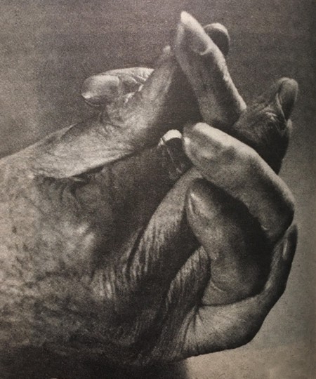 Aleister Crowley's hands locked in yogic mudra 
